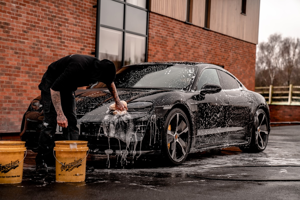 Apex technician applying precision paint protection film to vehicle
